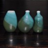 Three little green ceramic Vases